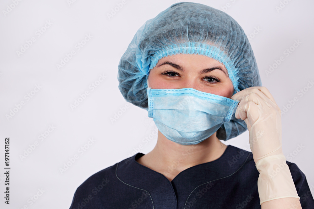 nurse puts a protective mask nurse puts a protective mask