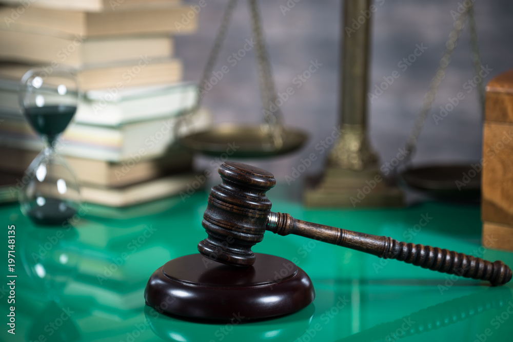 Law and Justice concept. Gavel of the judge, books, scales of justice. Brown background, Courtroom theme. Law and Justice concept. Gavel of the judge, books, scales of justice. Brown background, Courtroom theme.