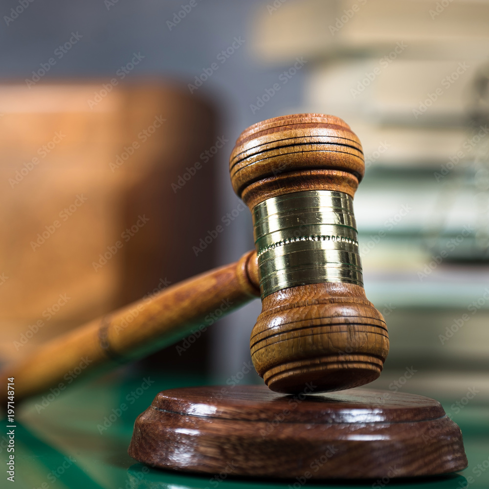 Law and Justice concept. Gavel of the judge, books, scales of justice. Brown background, Courtroom theme. Law and Justice concept. Gavel of the judge, books, scales of justice. Brown background, Courtroom theme.