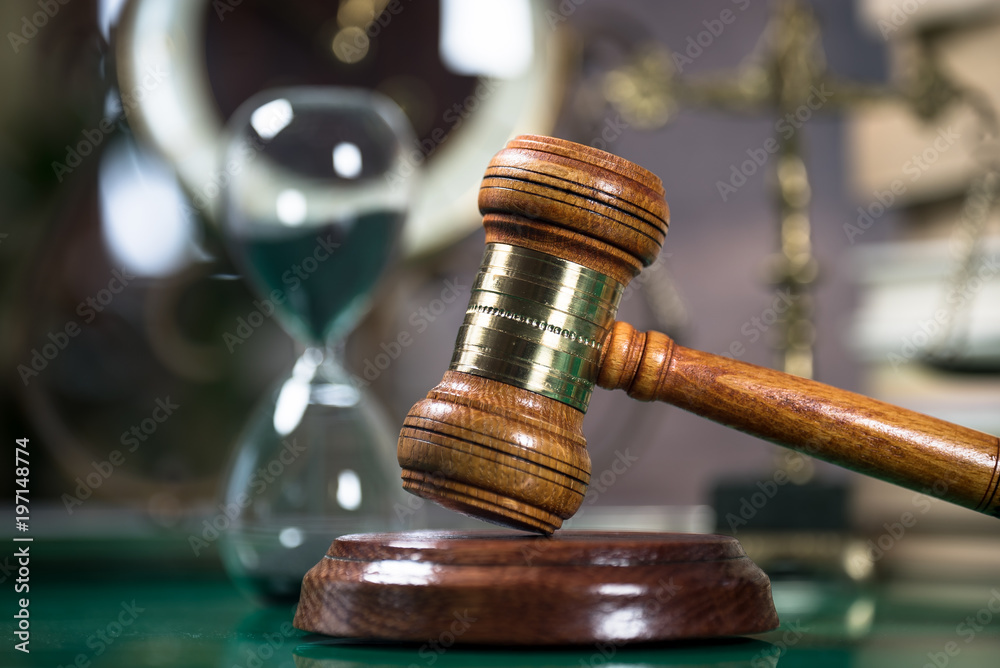 Law and Justice concept. Gavel of the judge, books, scales of justice. Brown background, Courtroom theme. Law and Justice concept. Gavel of the judge, books, scales of justice. Brown background, Courtroom theme.
