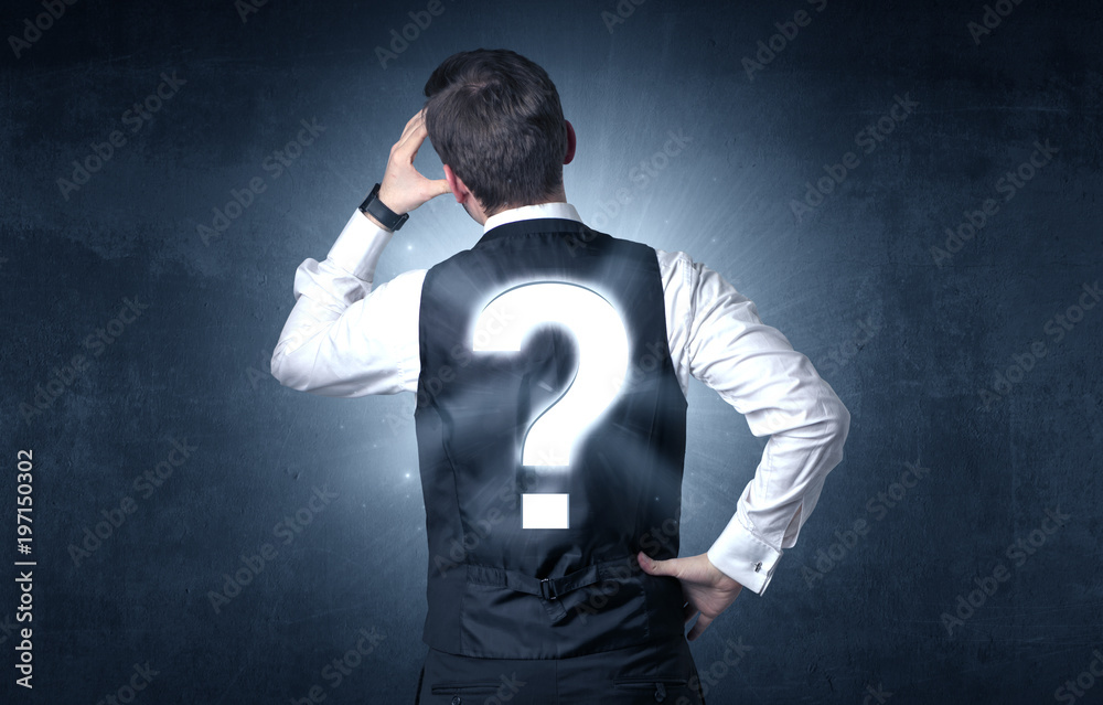 Man standing with question mark on his back Man standing with question mark on his back