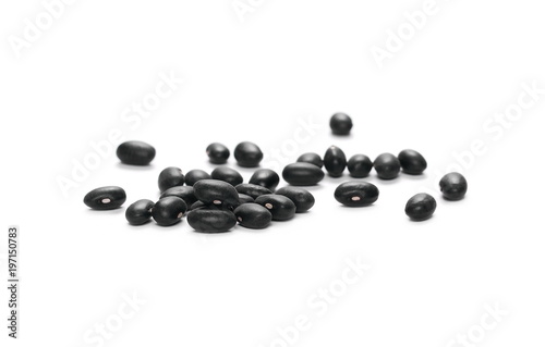 Pile organic black beans, isolated on white background