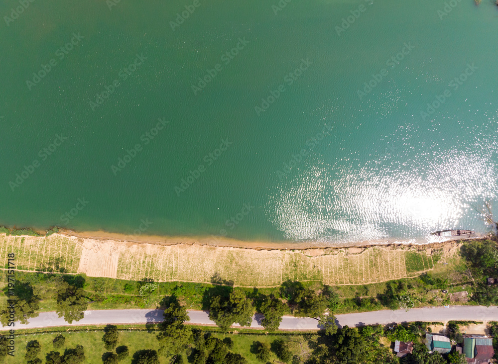 Drone shot of road and lake in Vietnam