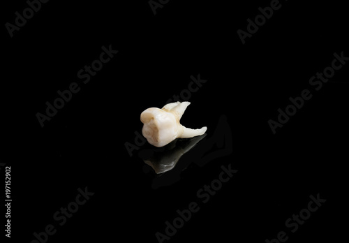 bad tooth remote on a black isolated background