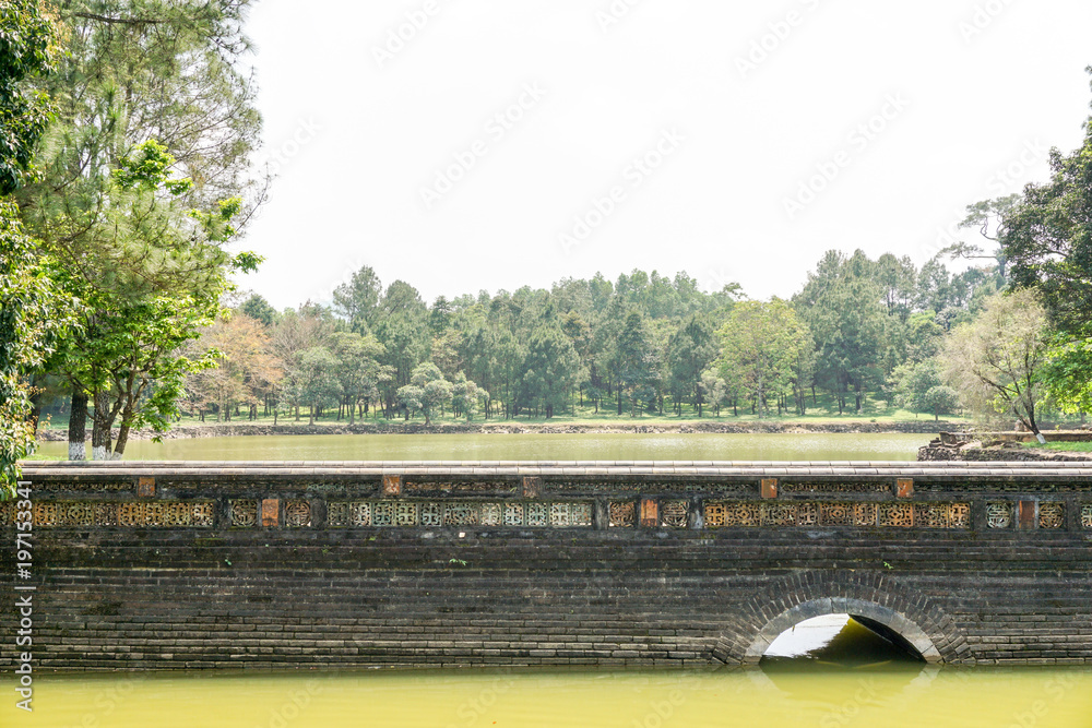 Bridge over pond in temple garden in Vietnam Bridge over pond in temple garden in Vietnam