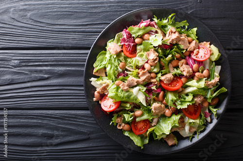 Принти на полотні Healthy hearty salad of tuna, borlotti beans, tomatoes, lettuce close-up on a plate
