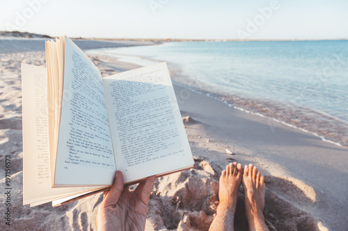 Reading book near the sea