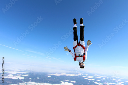 Skydiver is flying head down position.