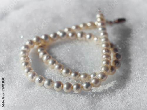 Pearl necklace on a snow