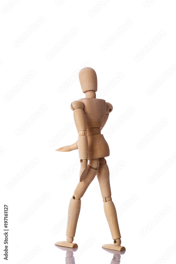 Wooden model walking isolated on a white background. Wooden model walking isolated on a white background.