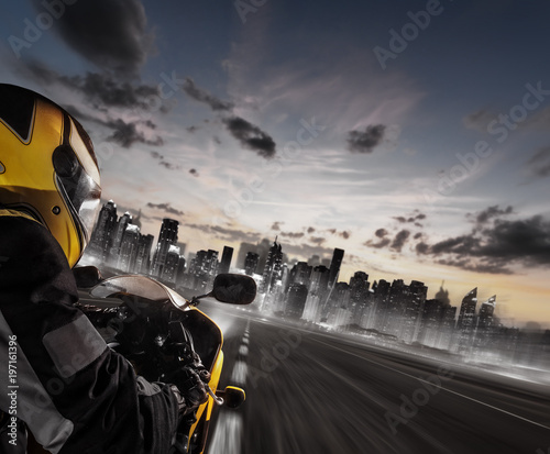 Supersport motorcycle rider heading to modern city skyline © Jag_cz