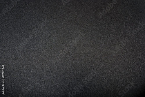 Teflon non-stick frying pan close-up. Kitchen. Black abstract background. Cooking food concept. photo