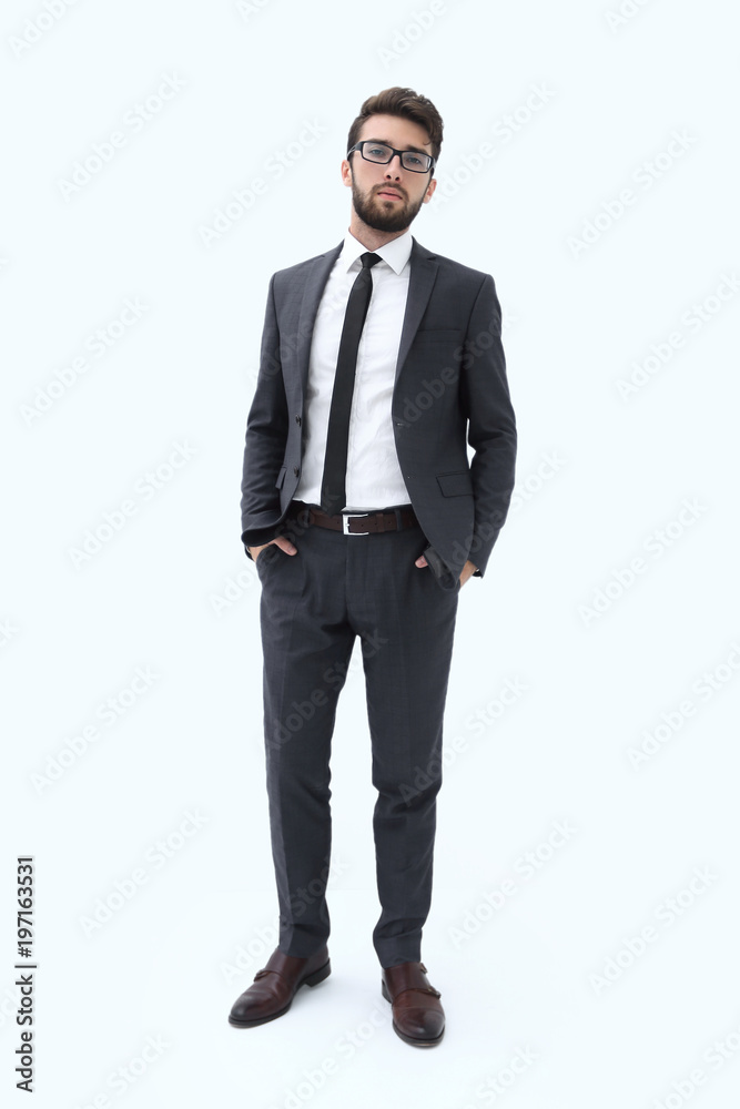 Young businessman standing with hands in pockets. Young businessman standing with hands in pockets.