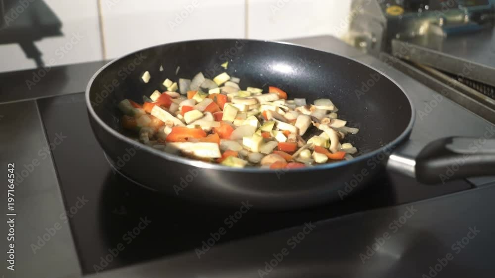 Man cooking vegetable stew