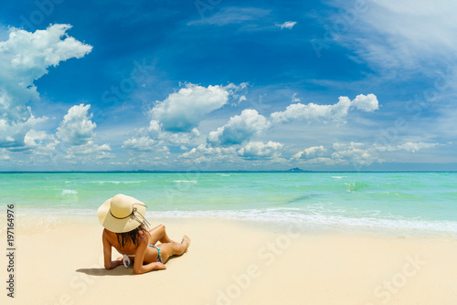 WOman alone on the beach in the Caribbean islands photo
