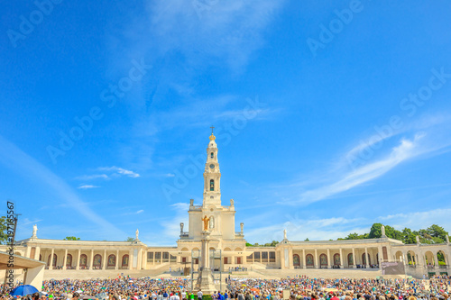 Tourists, faithful and pilgrims in the square of the Sanctuary of Fatima in Portugal for the 100th anniversary of the apparitions of the Virgin Mary. Copy space.