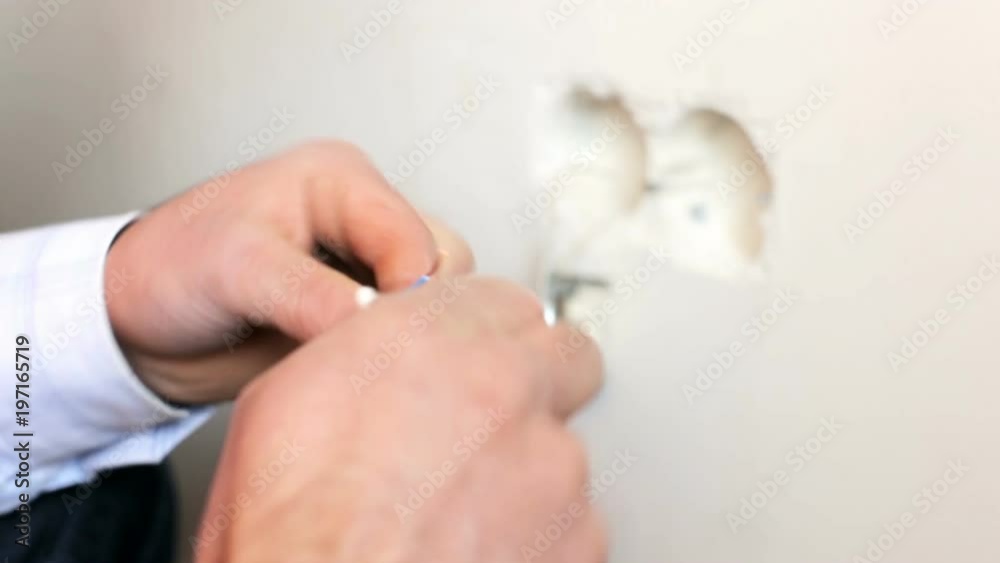 Electricians protects the wires to install sockets Electricians protects the wires to install sockets