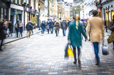 Motion blurred couple on shopping street