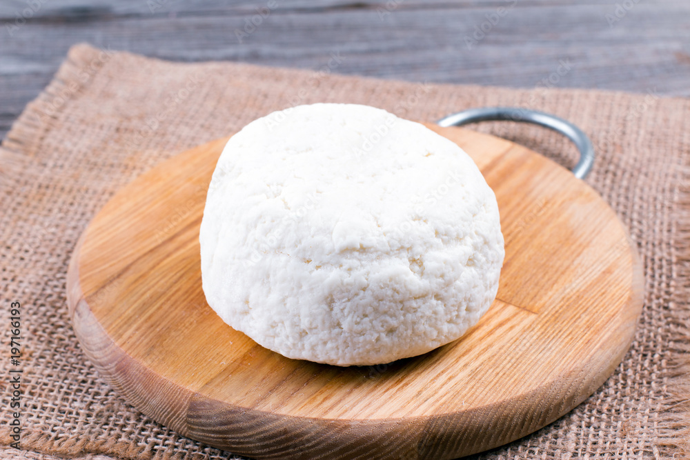 Bowl of mozzarella on a cutting board. Italian pizza Bowl of mozzarella on a cutting board. Italian pizza