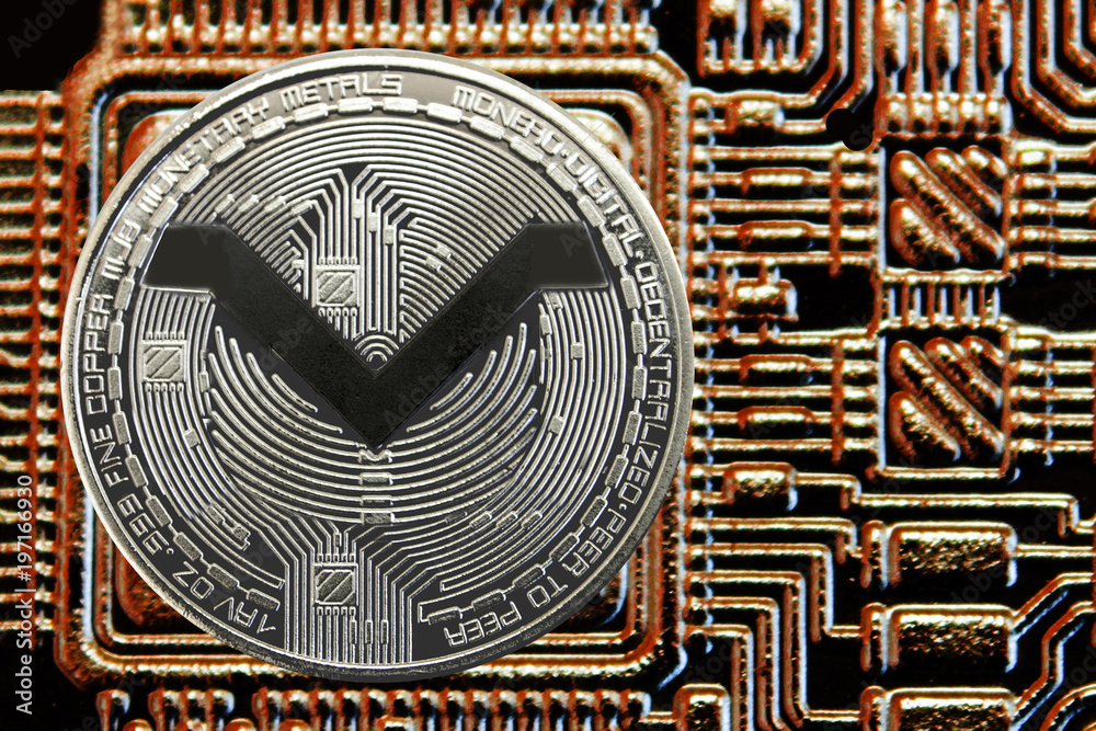 Silver coin cryptocurrency MoneroV on a background of gold circuit.