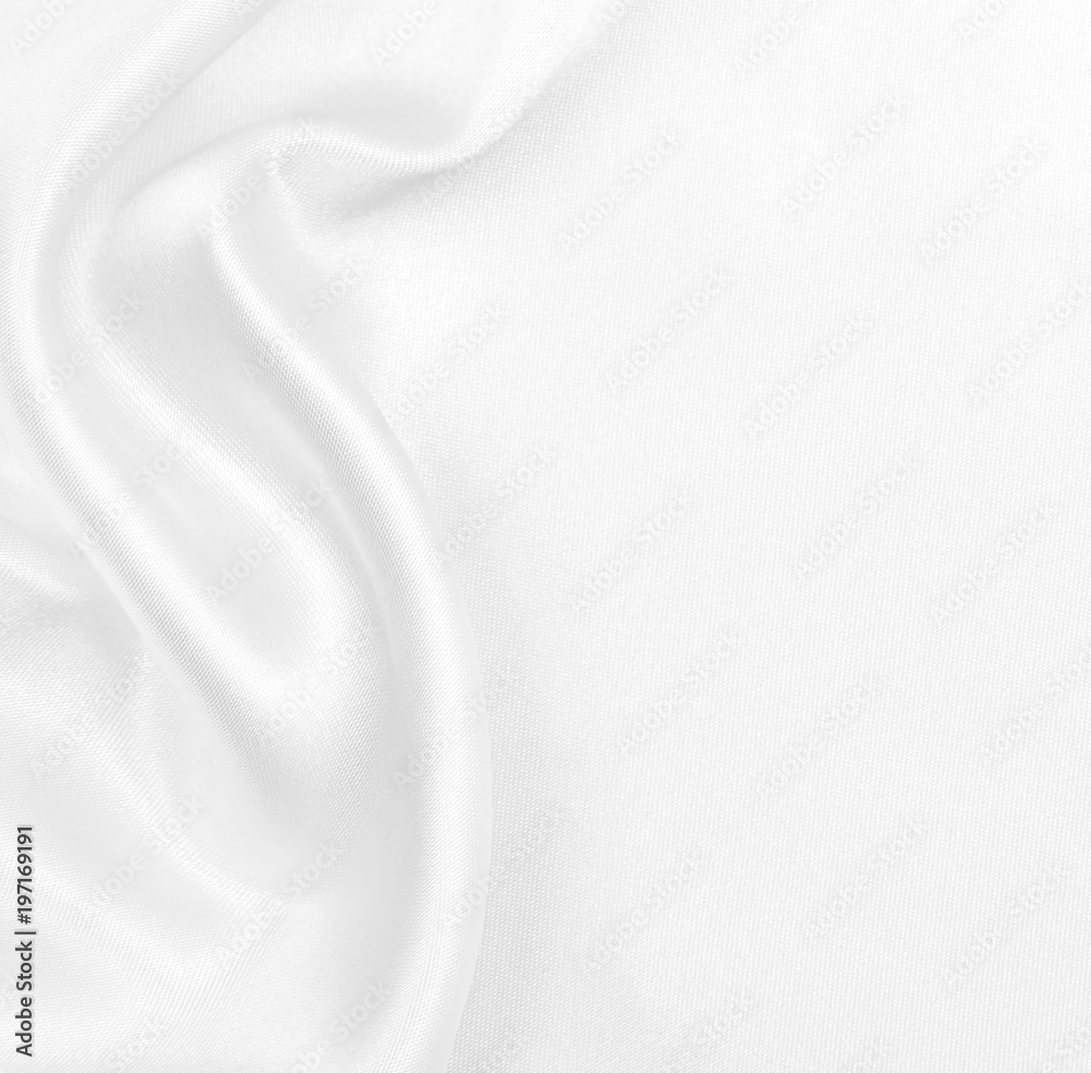Obraz premium Smooth elegant white silk or satin luxury cloth texture as wedding background. Luxurious Christmas background or New Year background design