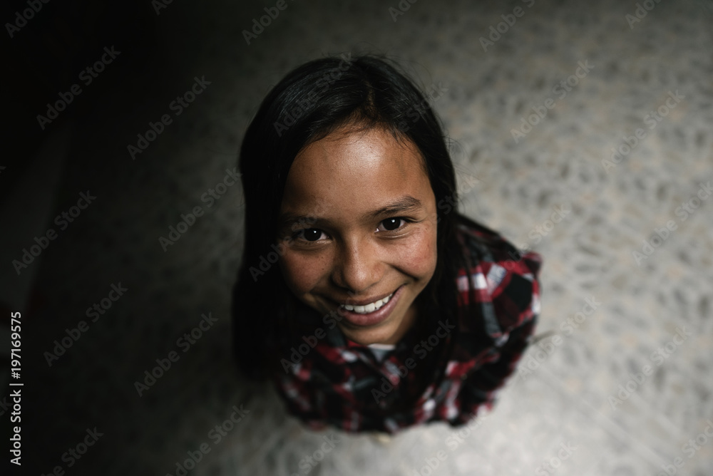 Wide portrait of beautiful girl in shanty town. Wide portrait of beautiful girl in shanty town.