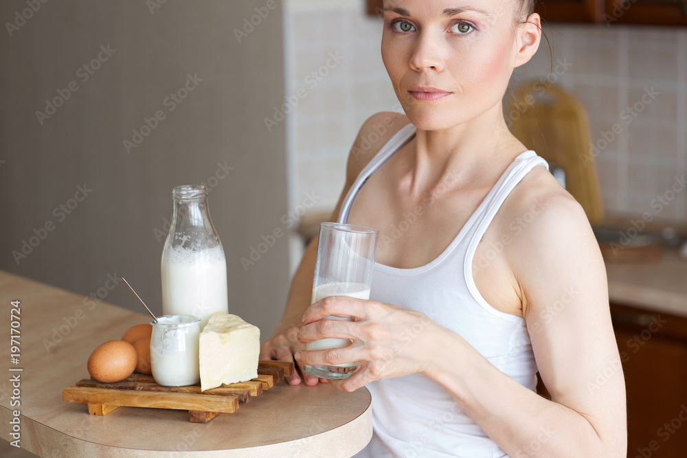 Young lady is drinking milk. Closeup Young lady is drinking milk. Closeup