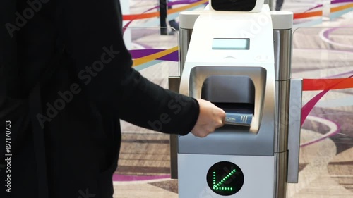 Immigration Automated Clearance System. Woman Scan Passport At Self-Check-In Customs. photo