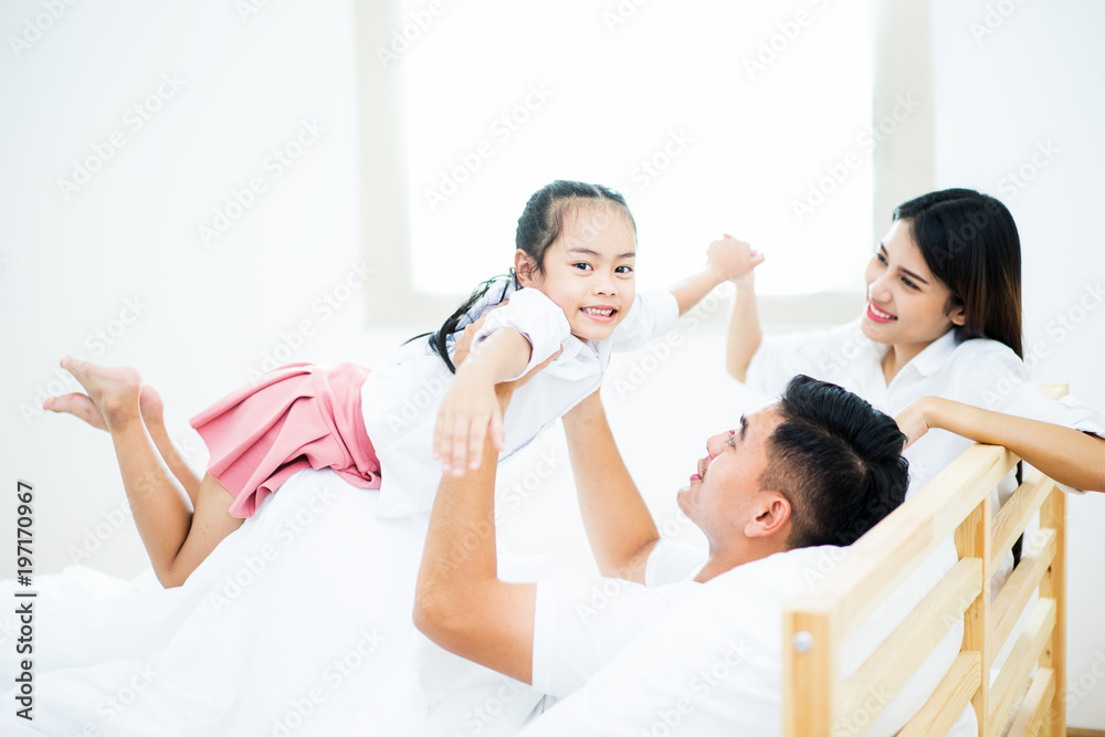 A happy asia family with kids in the living. A happy asia family with kids in the living.