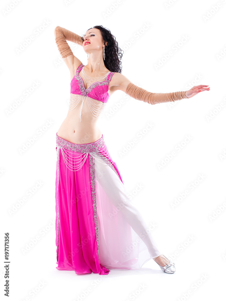 Arabian bellydancer sexy woman in white costume on white background. Oriental beauty model in studio portrait.