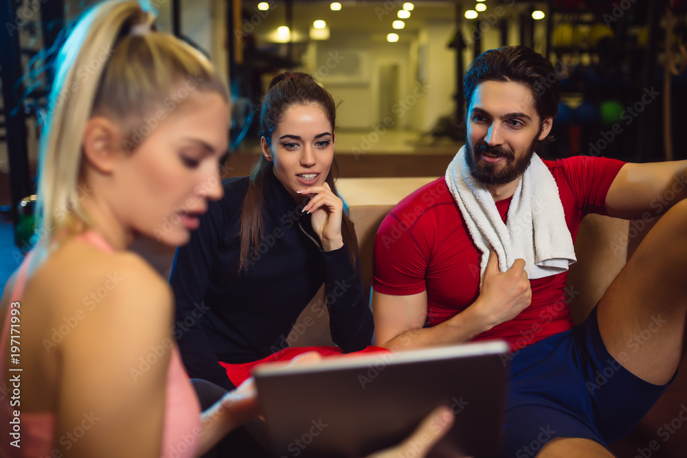 Group of friends relaxing after the training. Friends having conversation after exercising.Group of friends relaxing after the training. Friends having conversation after exercising. Group of friends relaxing after the training. Friends having conversation after exercising.Group of friends relaxing after the training. Friends having conversation after exercising.