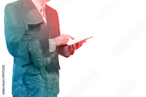 ouble Exposure of Businessman use Tablet with Architect Engineer or Contractor working with Wind Turbine Power Generator as Business Telecommunication and Investment in Energy photo