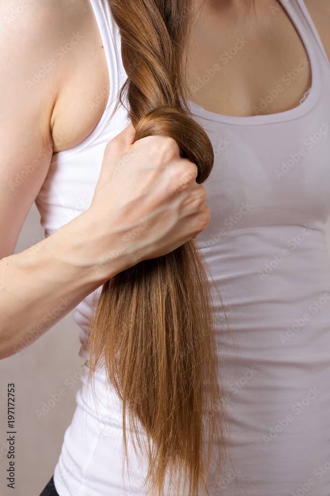 Naklejka premium Long hair of a young lady.