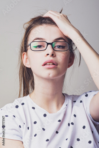 Obraz na plátně Modern young woman in glasses posing