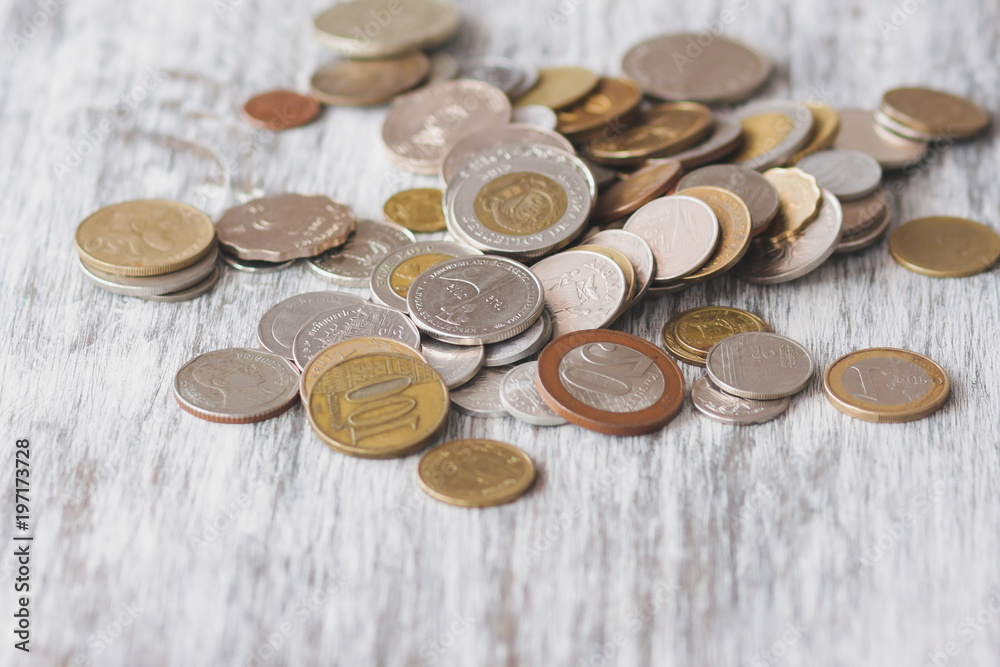 Different collector coins on the wooden background Different collector coins on the wooden background
