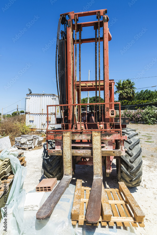 Old forklift in a construction site in Sicily, Italy
