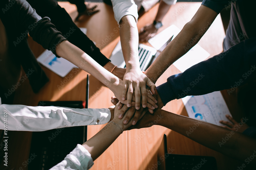 Business people join hand together at work place. team work concept. Business people join hand together at work place. team work concept.