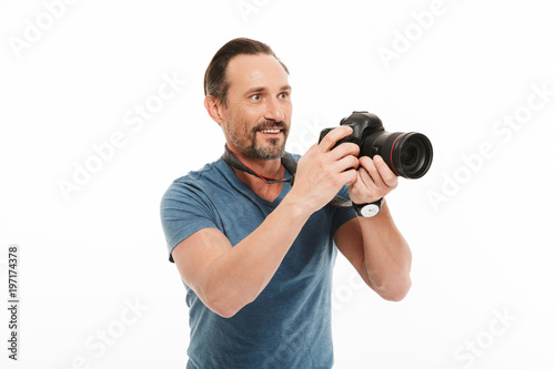 Cheerful mature man photographer