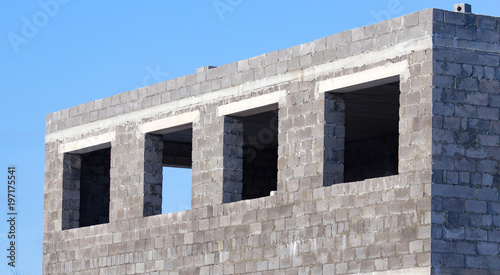 Windows in a brick house under construction