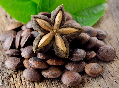 dried capsule seeds fruit of sacha-Inchi peanut on wooden