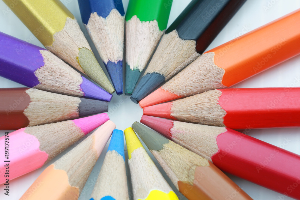 Colored pencils arranged in a circle.