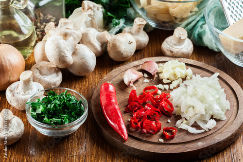 Ingredients ready for prepare tagliatelle pasta with champignon