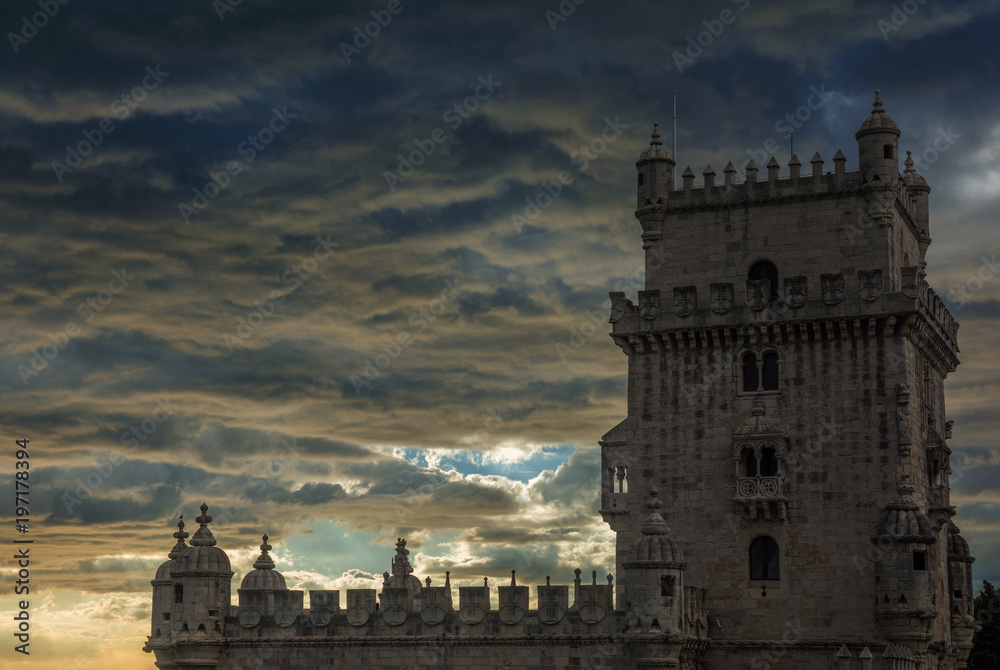 Belem Tower at sunset with dramatic sky
