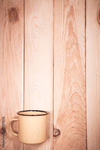 Cup on wood with space for text