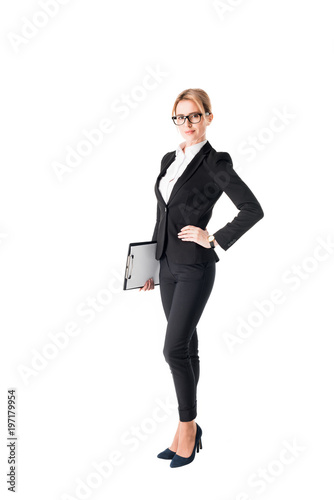 Blonde businesswoman holding clipboard isolated on white