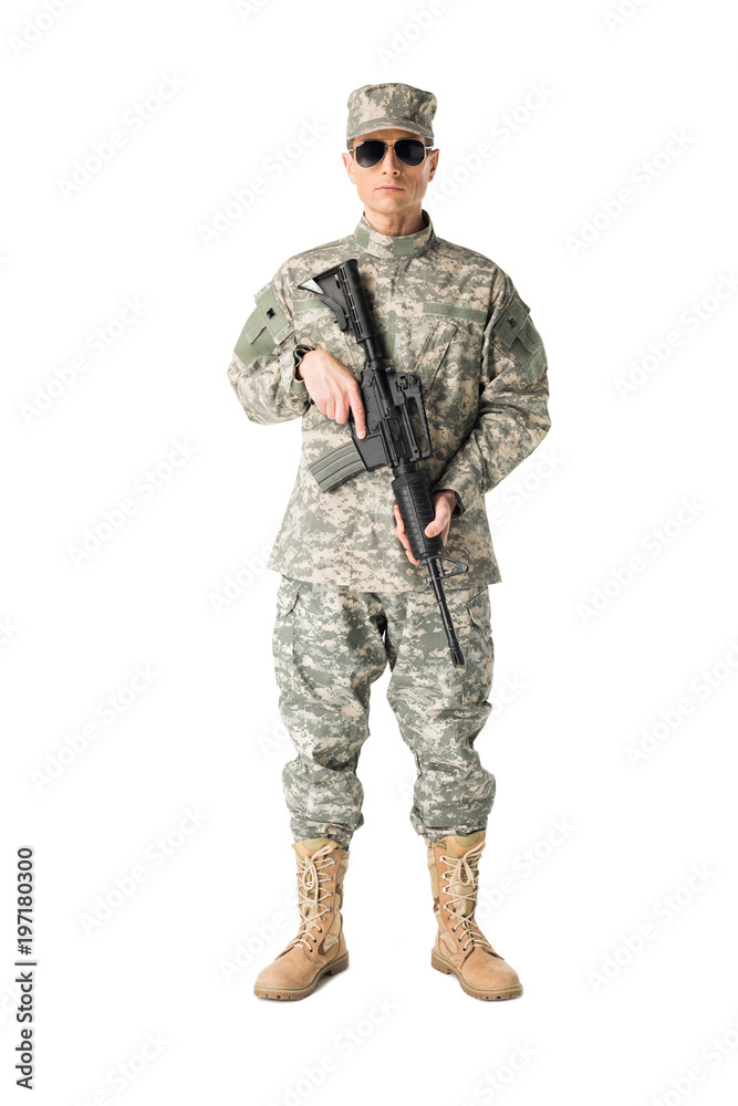 Serious army soldier with gun isolated on white