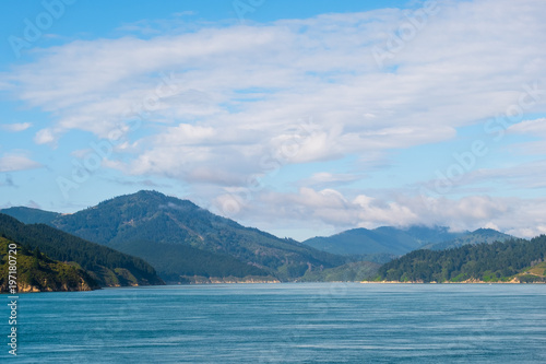 Landscape of the Mountain and sea with cloudy in the morning. View from the ferry to  South Island  New Zealand.