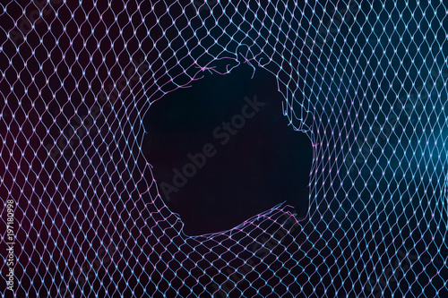 Abstract mesh net background with colorful ultraviolet holographic neon lights. Creative concept.