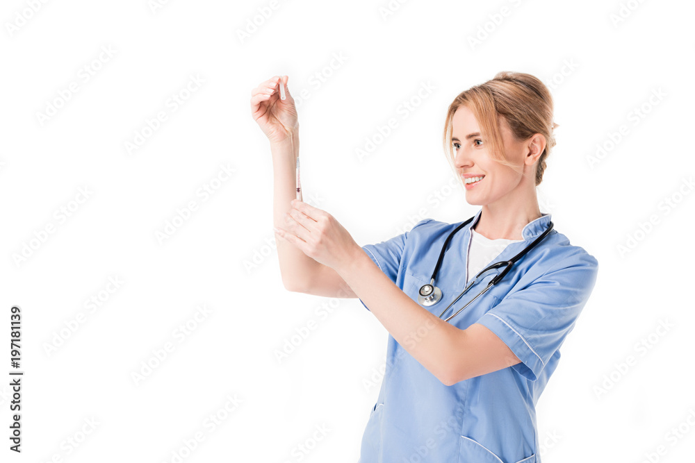 Smiling nurse filling syringe isolated on white Smiling nurse filling syringe isolated on white