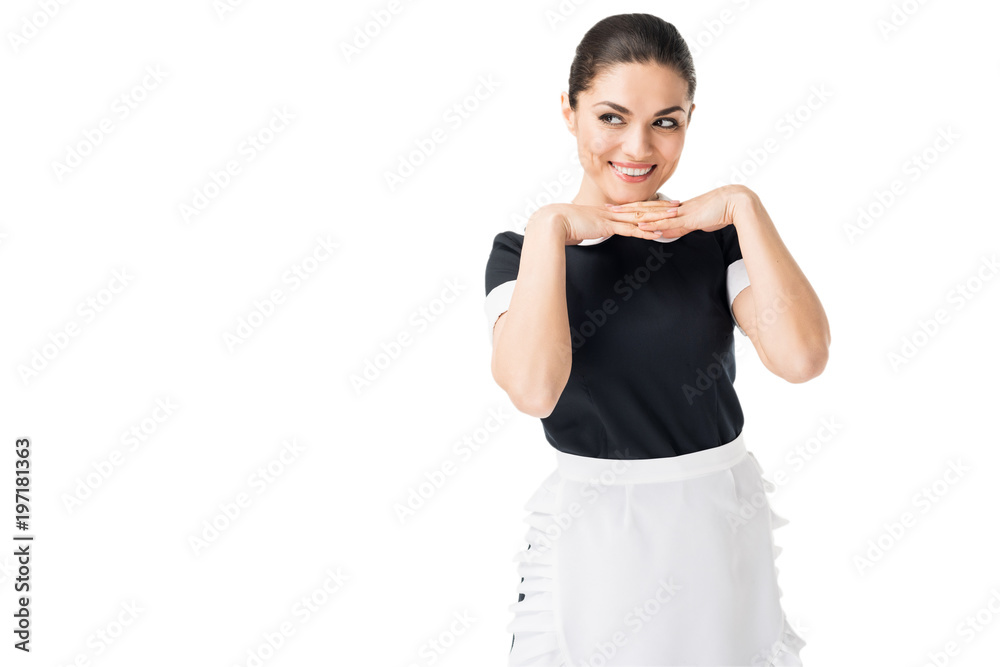 Smiling maid in professional uniform with hands by face isolated on white Smiling maid in professional uniform with hands by face isolated on white